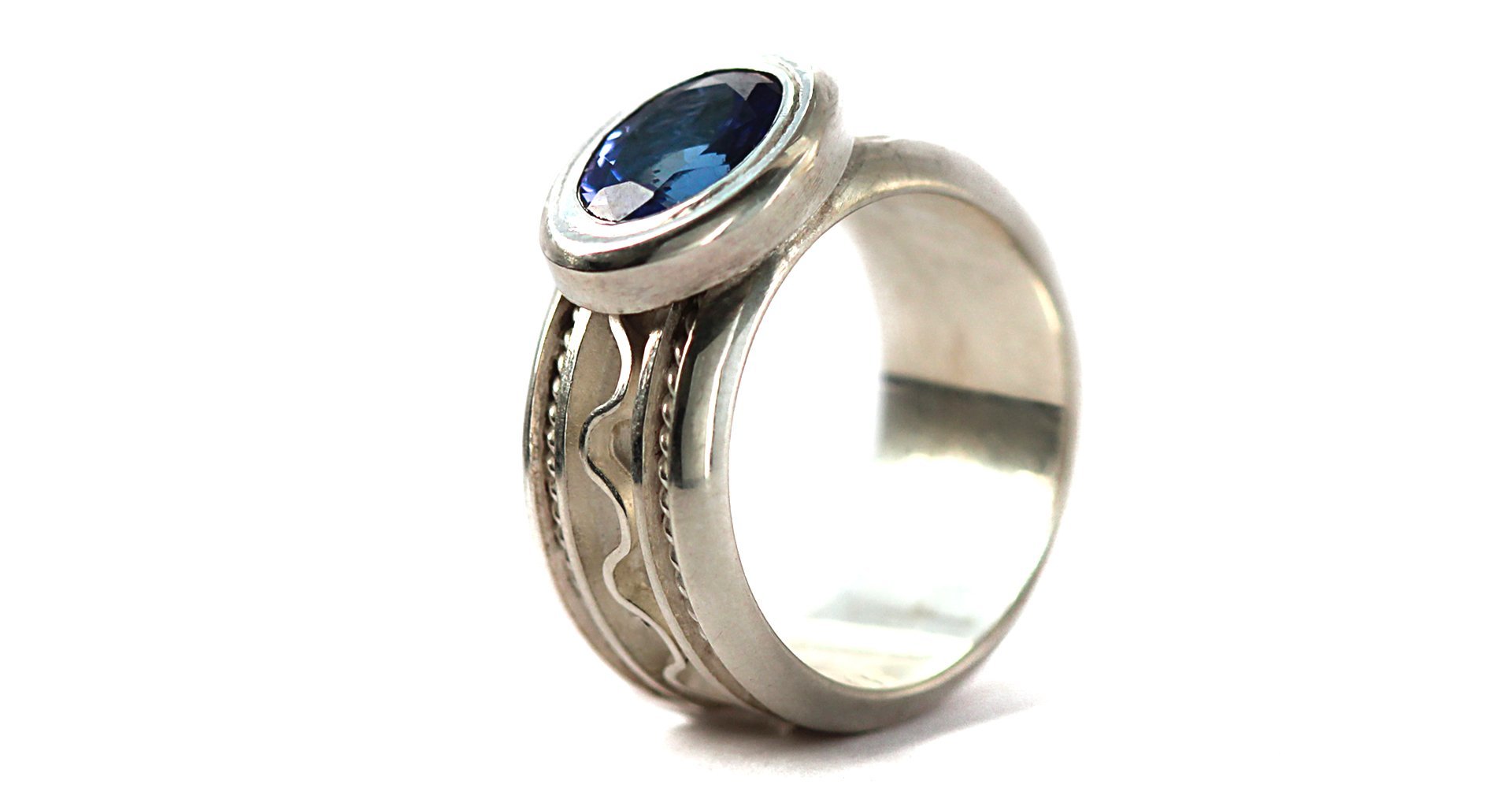 silver or gold misti ring with blue Tanzanite gemstone