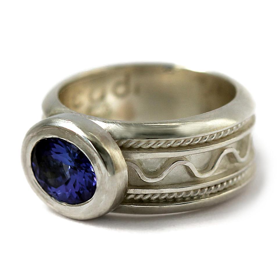 silver or gold misti ring with blue Tanzanite gemstone