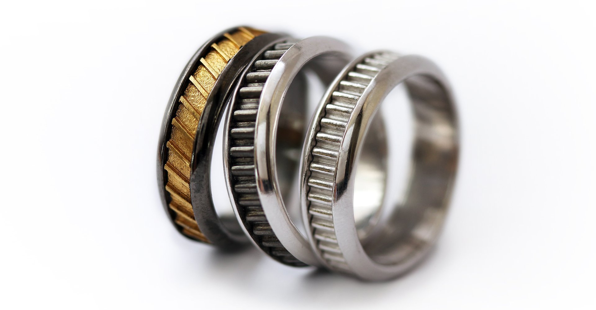 Black and gold and silver wedding band rings