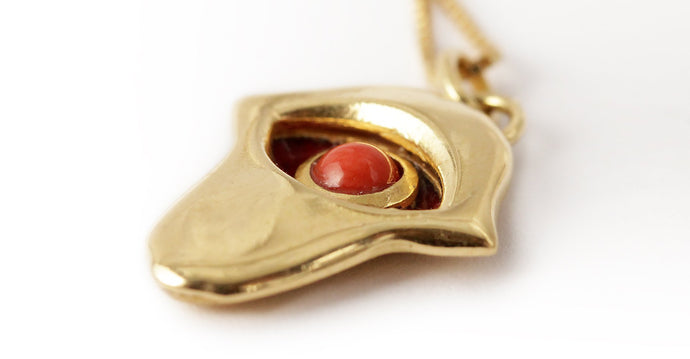  gold Hamsa hand necklace with red coral eye in natural red enamel
