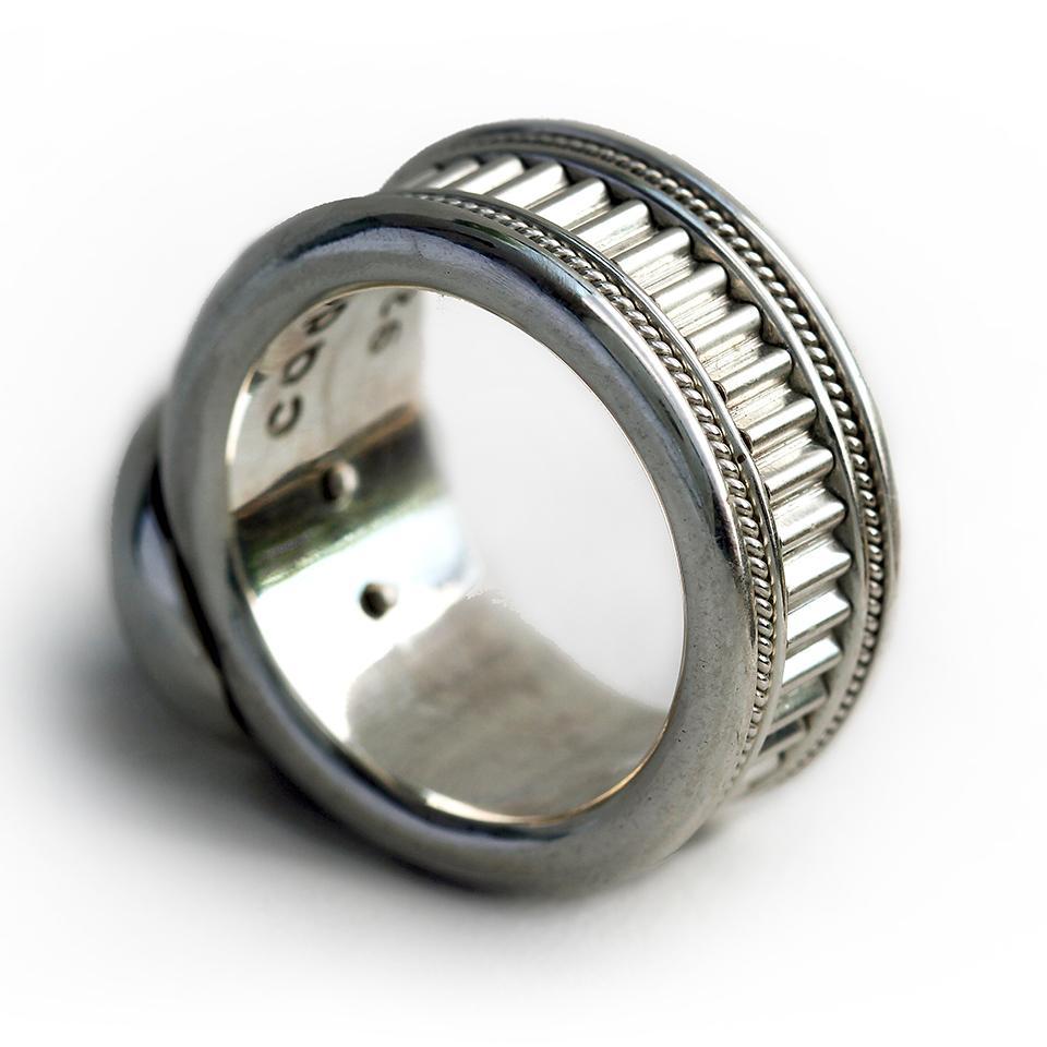 Man's silver misti wedding band with garnet
