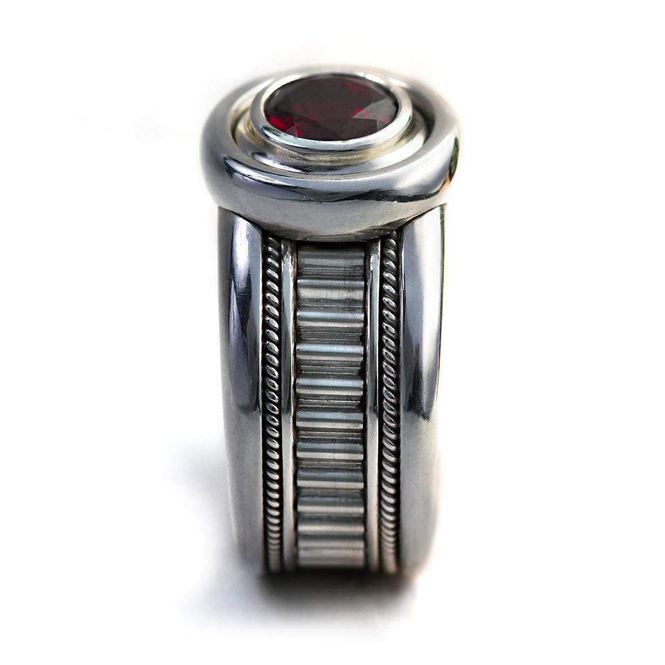 Man's silver misti wedding band with garnet