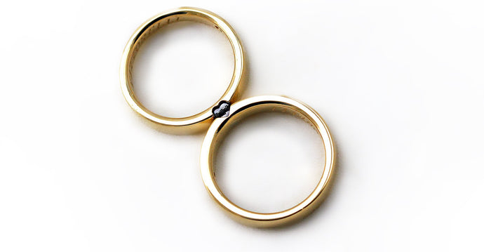 Gold couple promise rings set with Diamonds