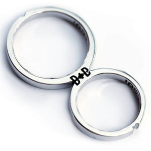Cadi delicate promise ring set with custom initials revealed when the narrow bands meet