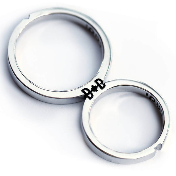 Cadi delicate promise ring set with custom initials revealed when the narrow bands meet