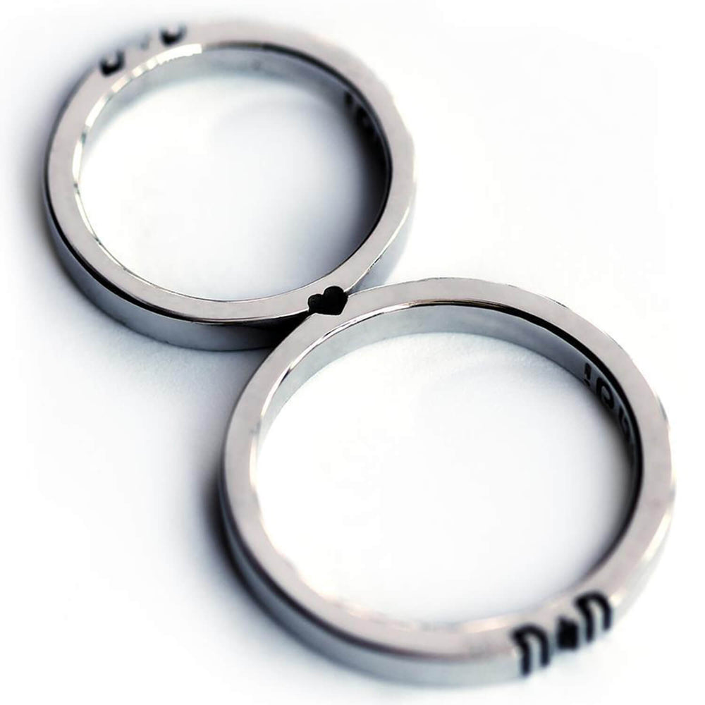Cadi delicate promise ring set with custom initials revealed when the narrow bands meet
