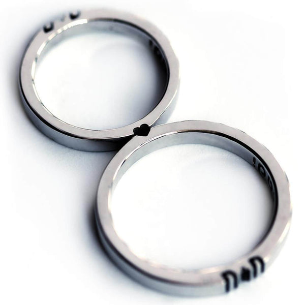 Detail of the engraved letter halves aligned across the two 3mm rings