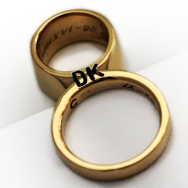 Cadi his and hers wedding bands with custom initials and contrasting 10mm and 3mm widths