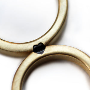 Hidden heart wedding ring set black diamond baguette detail, unique couple rings connect to reveal heart symbol, artisan made Barcelona
