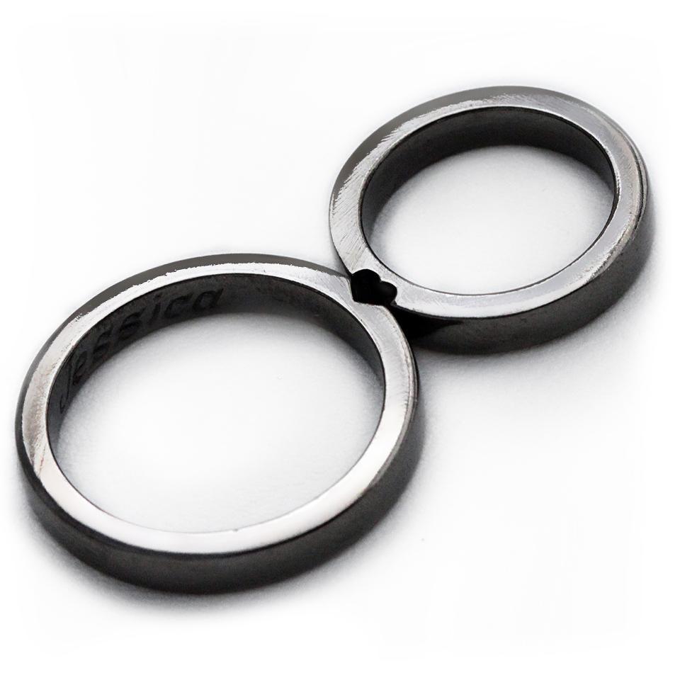 Cadi black rhodium wedding rings joined to reveal a hidden heart between the bands