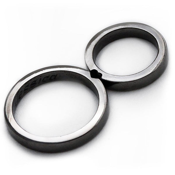 Cadi black rhodium wedding rings joined to reveal a hidden heart between the bands