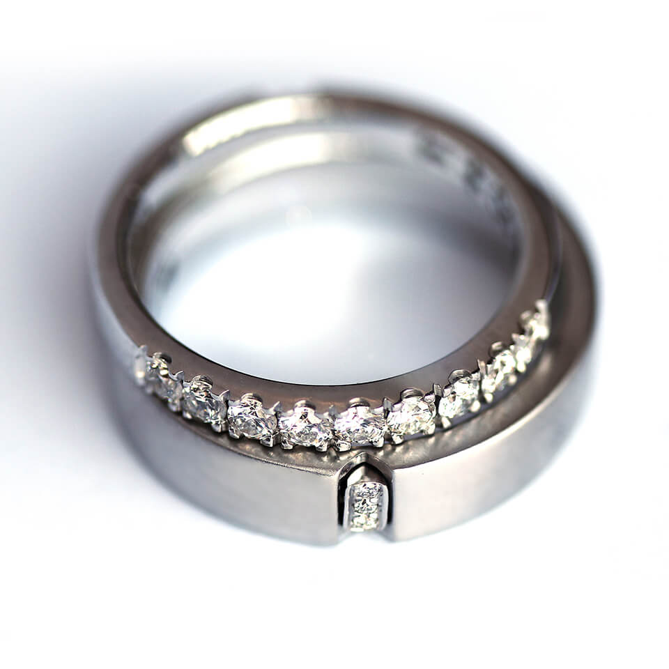 Cadi matching promise ring set with a wide band and diamond eternity band forming a hidden heart