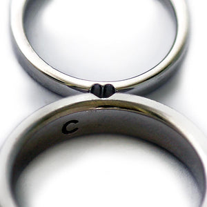 Detail of the wide and narrow bands showing the outer and central diamond heart settings