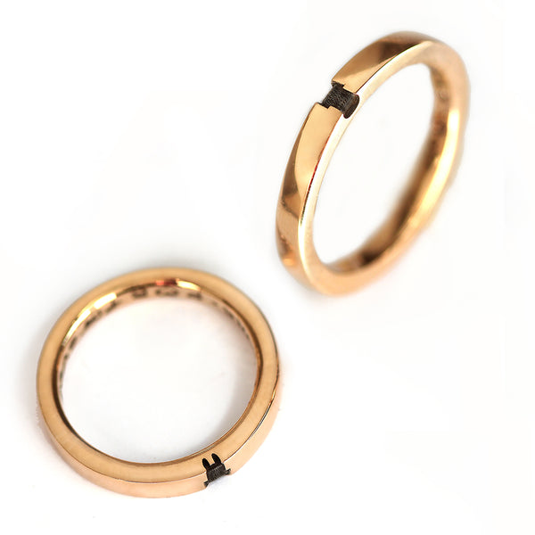Two polished rose gold animal couple rings shown separately, displaying the partial engraved animal details that combine into full silhouettes when worn as a pair.