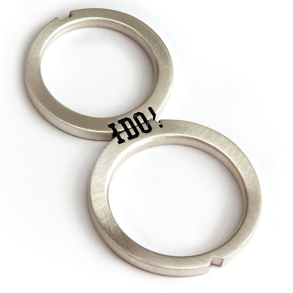 Cadi "I Do" wedding ring set with the engraved phrase divided across two narrow bands