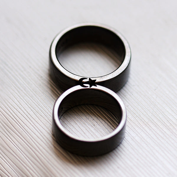 Cadi black rhodium moon and star ring set joined to complete the celestial symbols