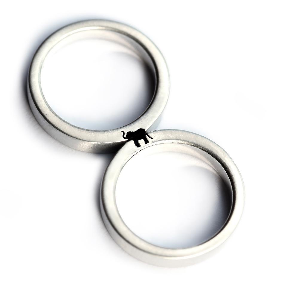 Cadi elephant couple rings joined to reveal a hidden elephant symbol