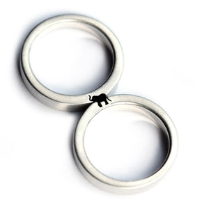 Cadi elephant couple rings joined to reveal a hidden elephant symbol