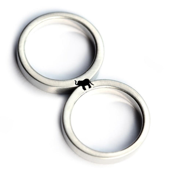 Cadi elephant couple rings joined to reveal a hidden elephant symbol