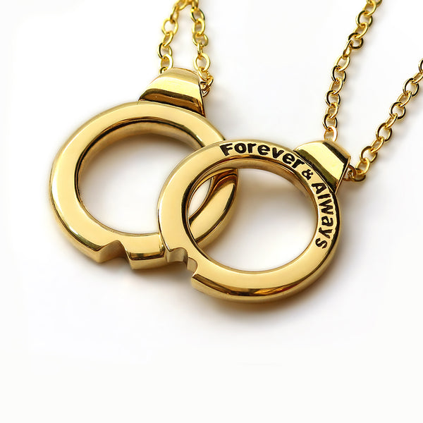 Matching romantic pendant necklace set with two interlocking yellow gold circle charms that connect to form a heart and can be worn together or separately