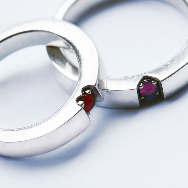 Hidden heart wedding rings ruby and rose quartz forming symbol when united, handmade white gold matching bands Barcelona artisan jewelry, love stone couple set