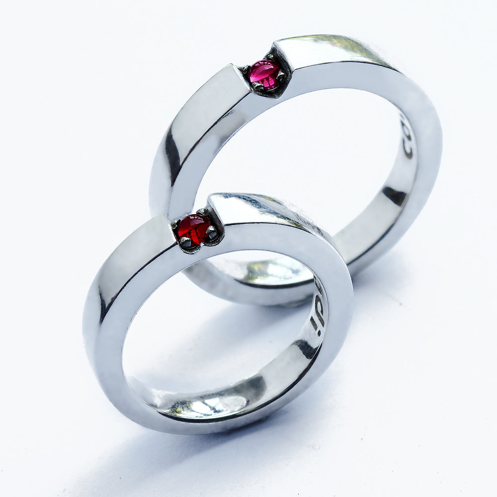 Custom wedding rings forming hidden heart when placed together, ruby and rose quartz accent bands handmade white gold, unique couple ring set romantic gemstones