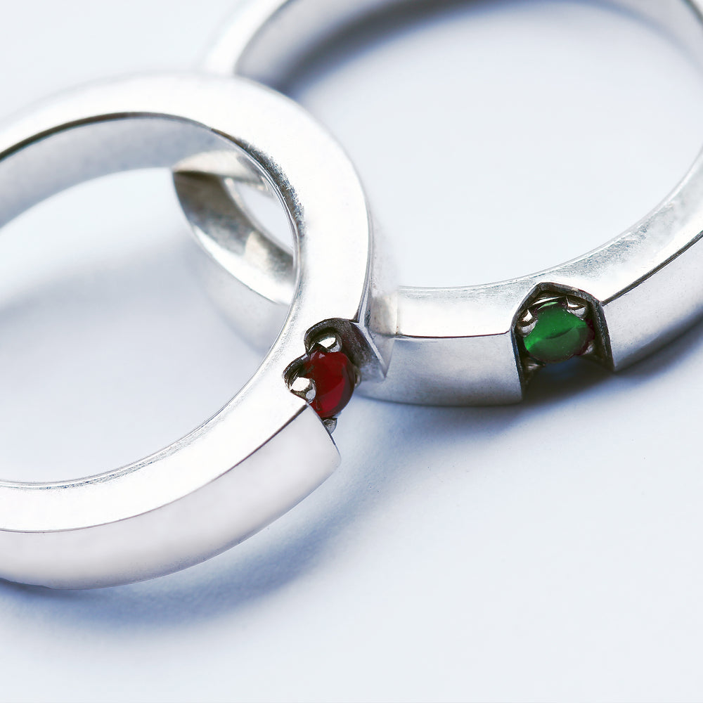 Hidden heart wedding rings ruby and tsavorite garnet forming symbol when united, handmade white gold matching bands Barcelona artisan jewelry, rare gemstone couple set