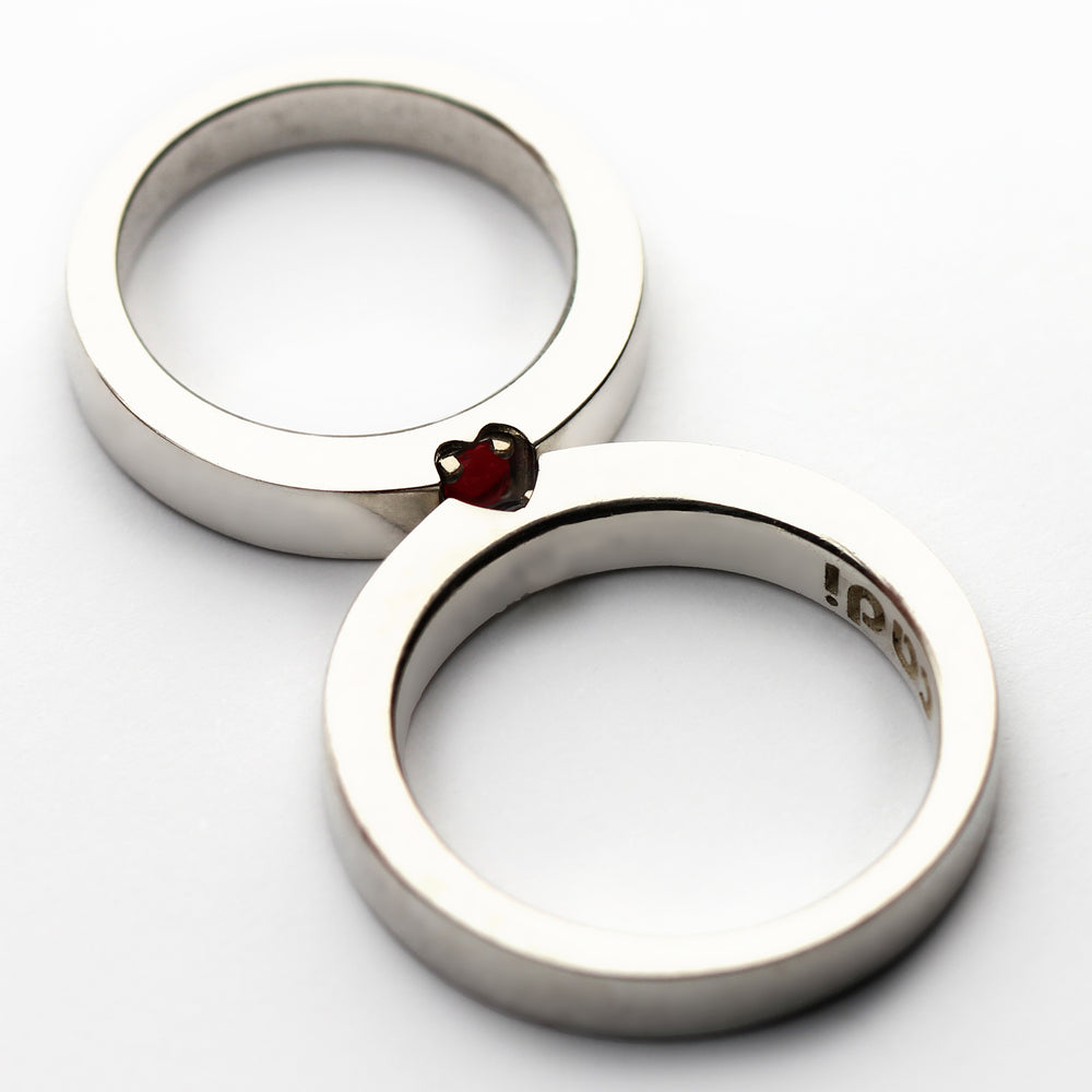 Hidden heart wedding rings ruby and tsavorite garnet forming symbol when united, handmade white gold matching bands Barcelona artisan jewelry, rare gemstone couple set