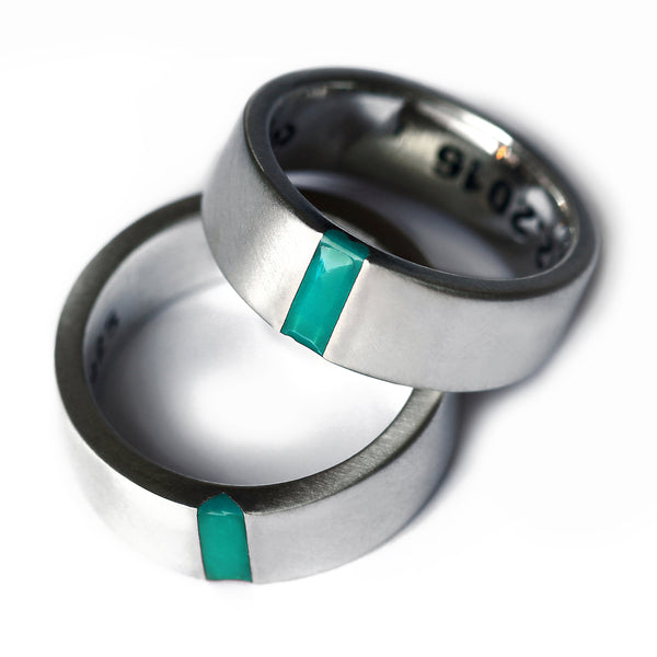 Matching silver wedding bands with turquoise enamel inlay, hidden heart negative space couple rings.