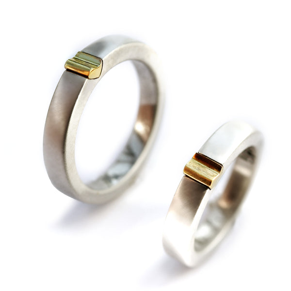 Two-tone magnetic couple rings, white gold bands with yellow gold heart-connector detail, his and hers set