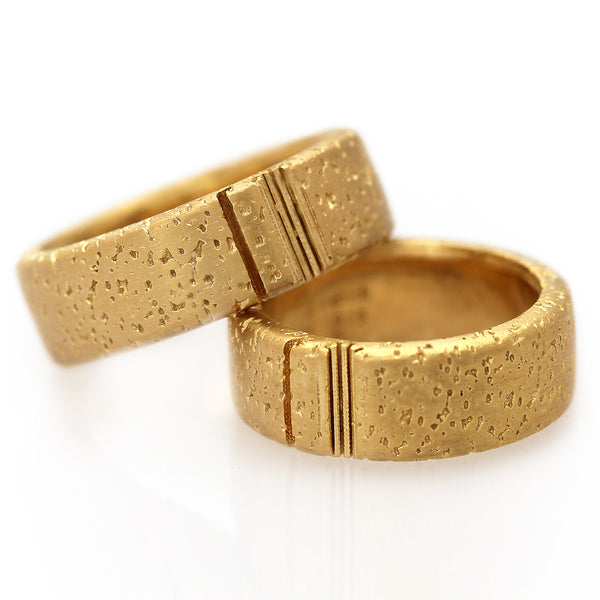 Detail of the minimalist bands showing the interlocking celestial motif