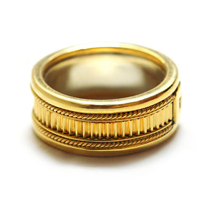 Luxury masculine gold anniversary band with purple sapphire and decorative rope detailing