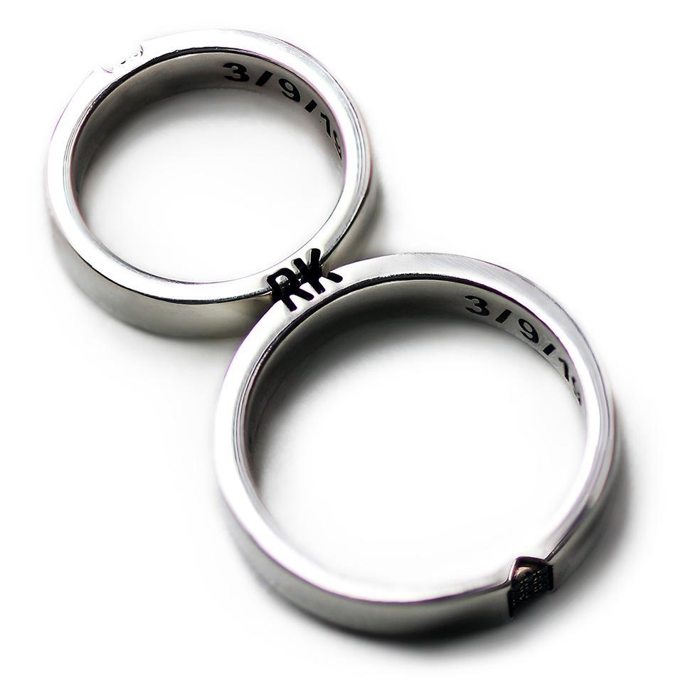 Cadi promise ring set with black and white diamond inlays and custom initials