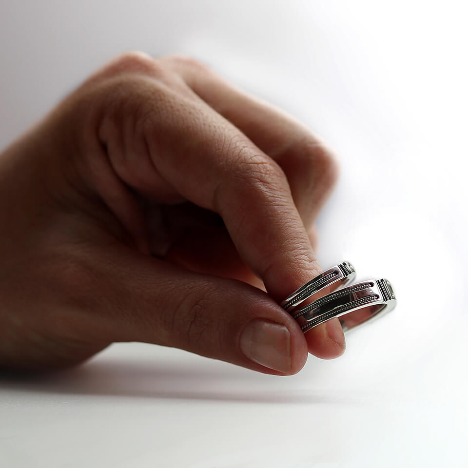 Cadi filigree puzzle wedding bands with wide and narrow rings designed to interlock