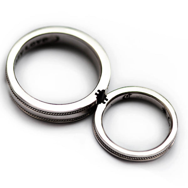 Cadi filigree puzzle wedding bands with wide and narrow rings designed to interlock