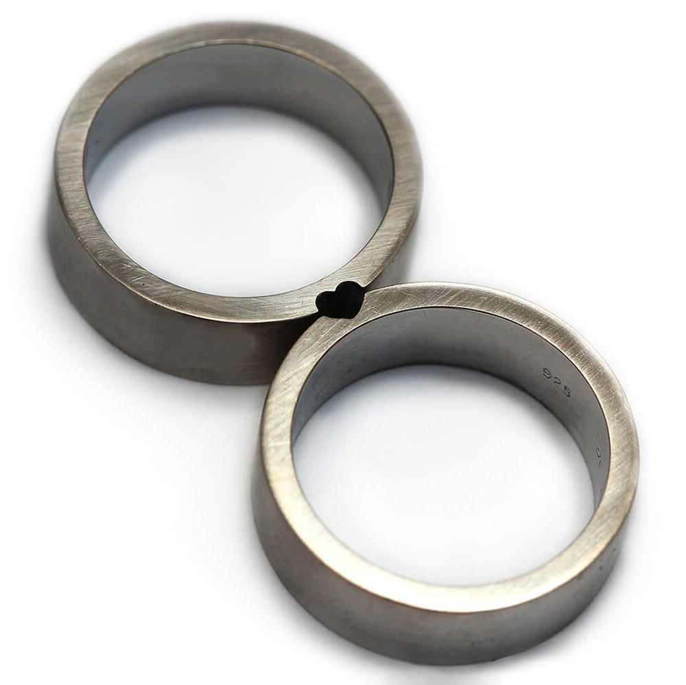Cadi 925 sterling silver promise rings joined to form a hidden heart between the bands