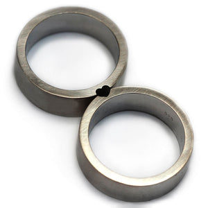 Detail of the brushed silver bands and matching heart-shaped recesses