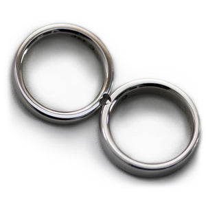 Cadi diamond promise ring set with a wide three-stone band and a narrow matching band