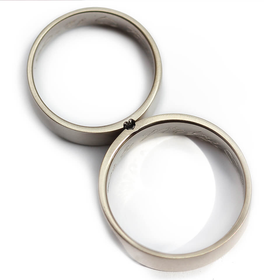 Cadi black and white diamond rings joined to form a hidden heart