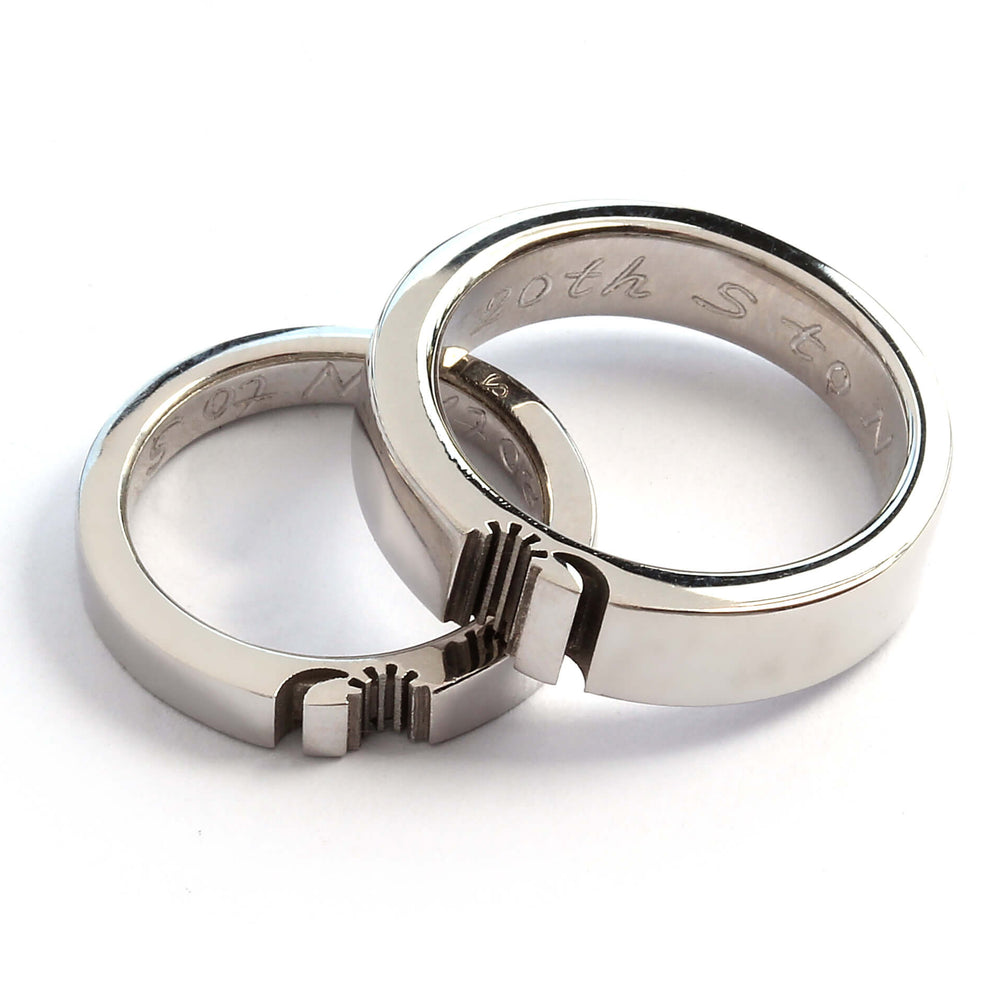 Cadi sun and moon ring set with wide and narrow bands aligned to complete the celestial design