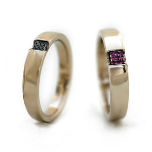 Two mens wedding bands with sapphire ruby emeralds