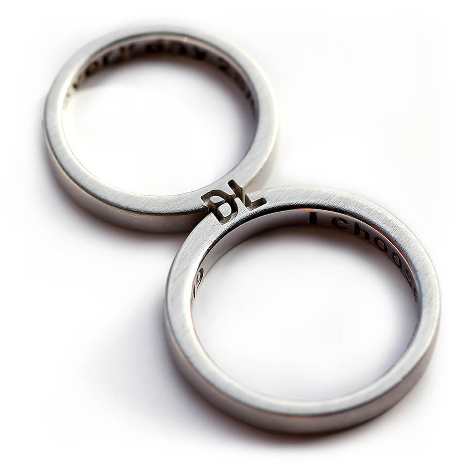 Cadi personalized couple rings with custom initials engraved across the matching bands