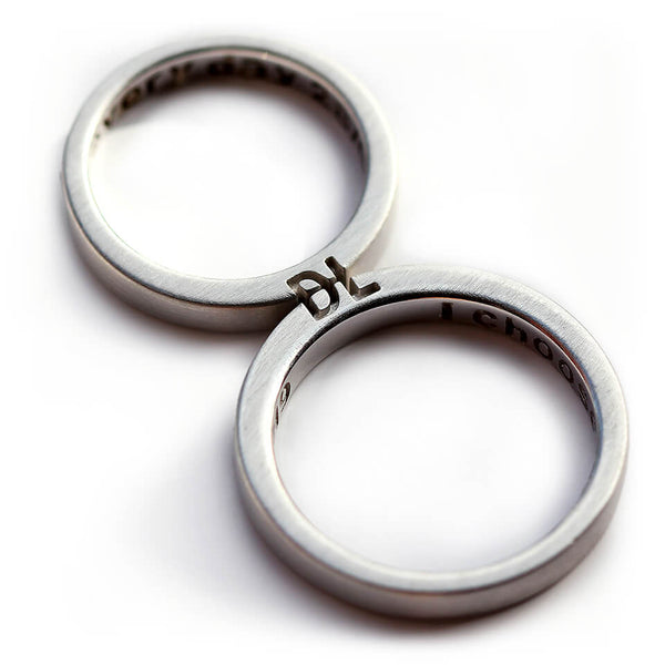 Cadi personalized couple rings with custom initials engraved across the matching bands