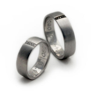 Cadi matching promise rings with black and white diamonds forming a hidden heart