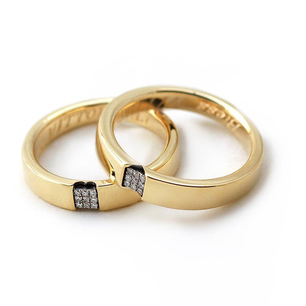 Gold couple promise rings set with Diamonds