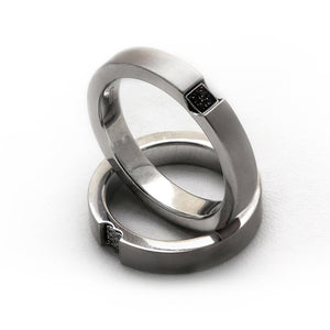 Two white gold promise rings for couples with diamonds
