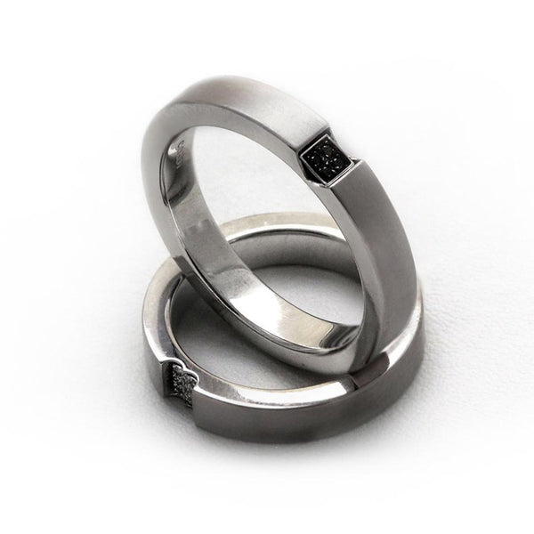 Two white gold promise rings for couples with diamonds