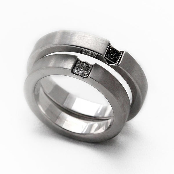Two white gold promise rings for couples with diamonds