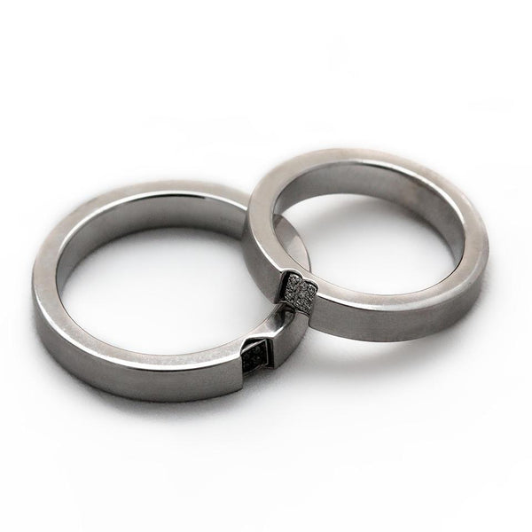 Two white gold promise rings for couples with diamonds