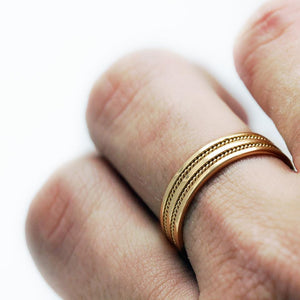 yellow gold romise ring set with braided filigree